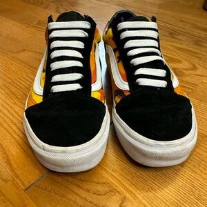 Old Skool Vans black and orange women’s size 7.5. In used condition as shown.